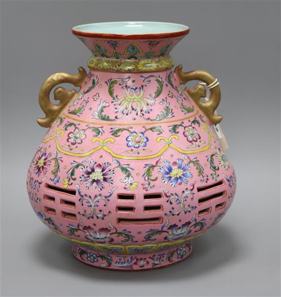 A Chinese pink sgraffito ground double wall vase height 30cm